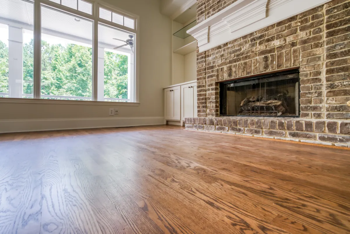 Oak Refinish — Living Room with Brick Fireplace